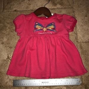 Carries matching shirt and shorts 6-9M